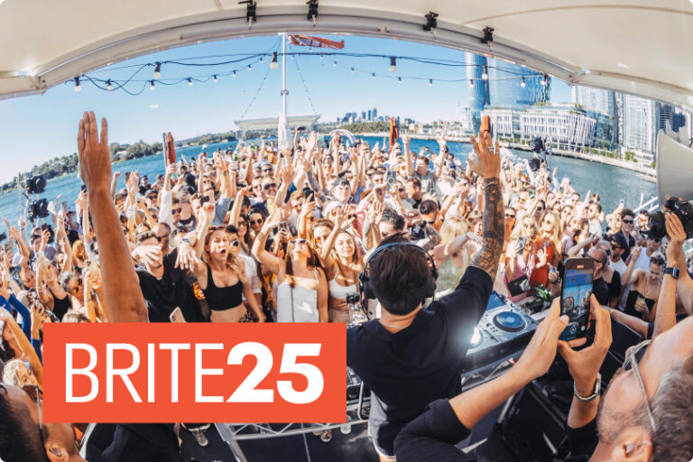Attendees dance at a Glass Island party